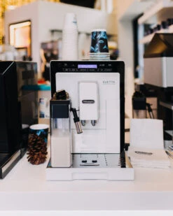 Refurbished DeLonghi Eletta Cappuccino In White ECAM44660W -Coffee Shop delonghi social lifestyle eletta white coffee n clothes event all rights jan 2099